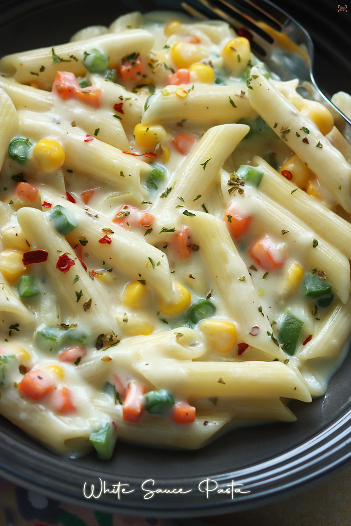 white sauce pasta served in a grey pasta bowl