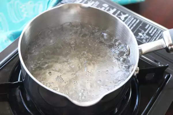 boil water until rolling boil