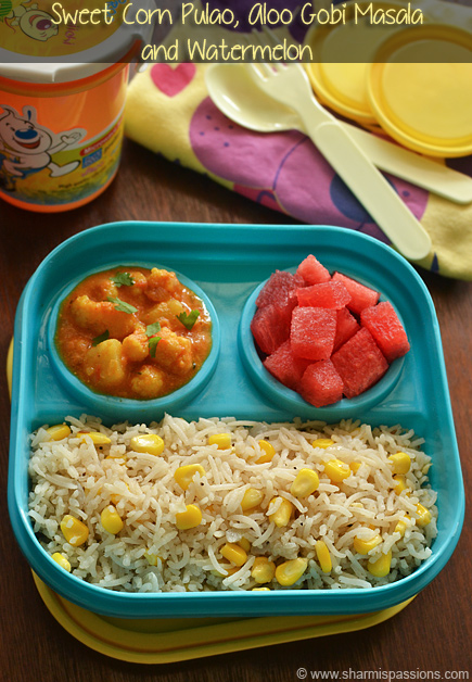 sweet corn fried rice with aloo gobi masala and cut watermelon