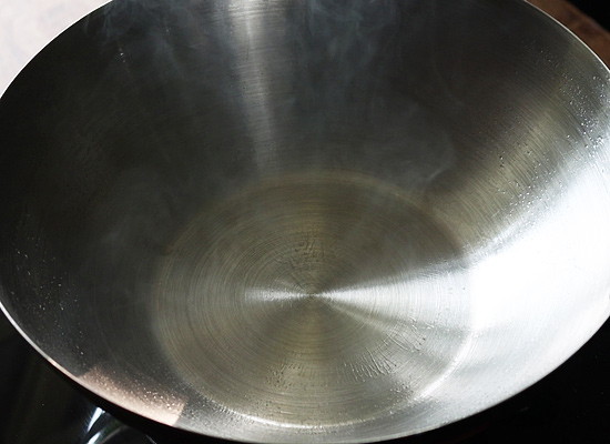 season steel cookware heat in low flame