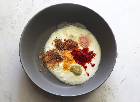 curd along with spice powders,salt and ginger garlic paste is added in a bowl