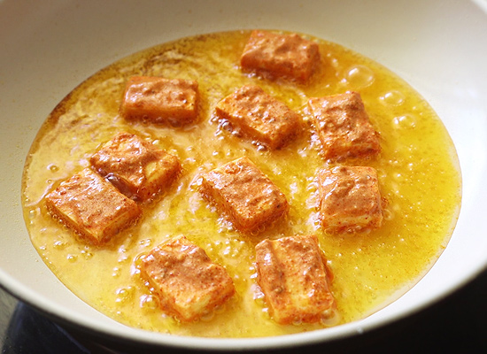 heat oil in a pan shallow fry the paneer pieces in batches