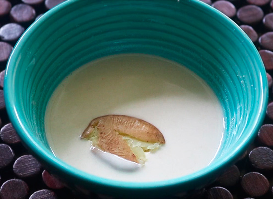 dipping potato in the butter