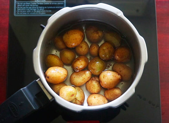 add potatoes to pressure cooker