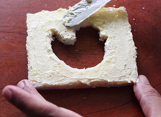 apply butter on another cut out slice