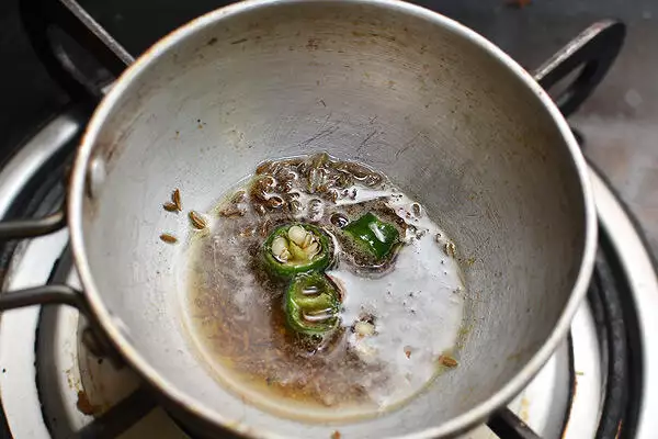 prepare the tadka with oil, ghee,cumin seeds and green chili