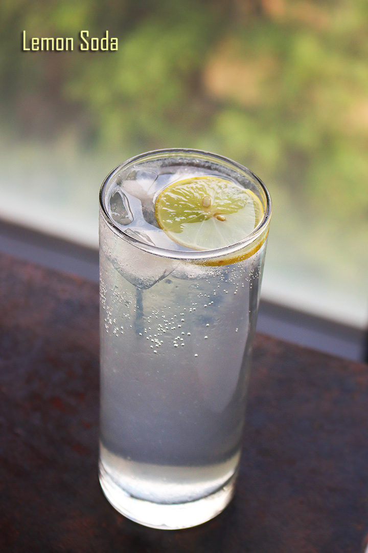 lemon soda served in a tall glass with ice cubes