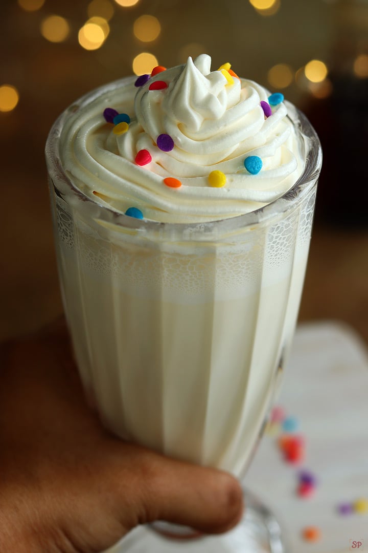 vanilla milkshake served in a tall glass