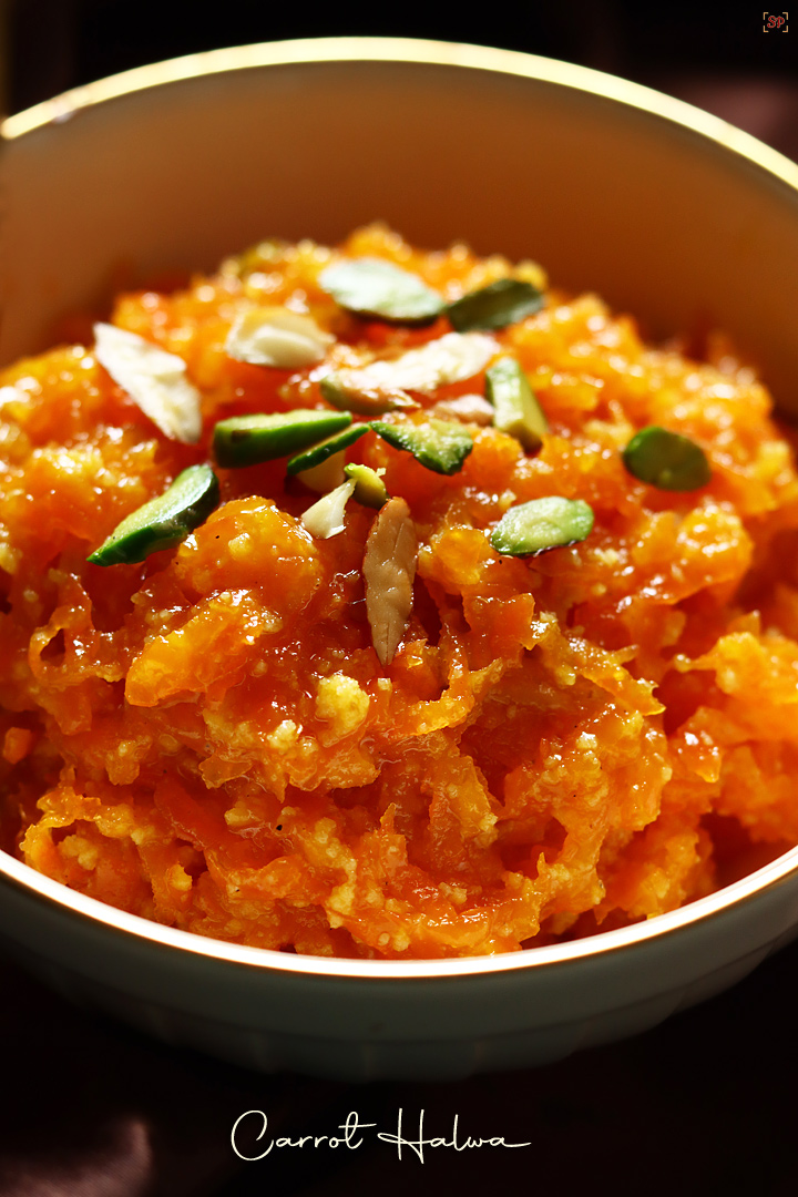 carrot halwa served in a beige colored bowl