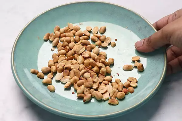 remove the skin from the peanuts