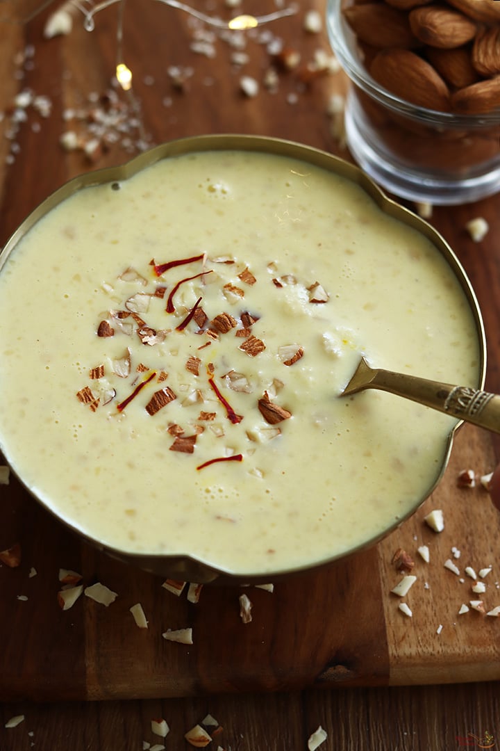 badam kheer served in a gold color bowl