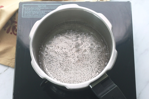 boil water in cooker.
