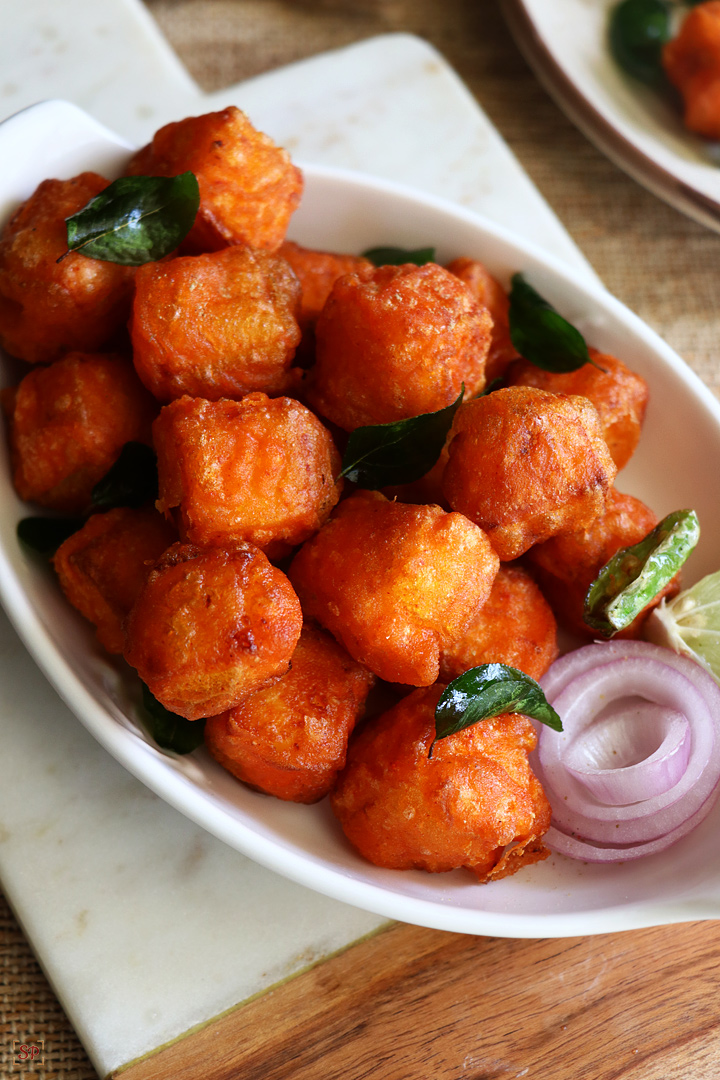 paneer 65 served in a white serving bowl