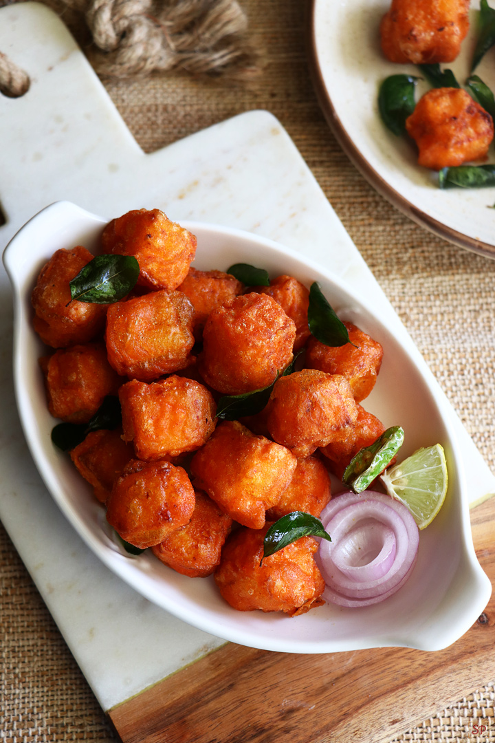 paneer 65 served in a white serving bowl