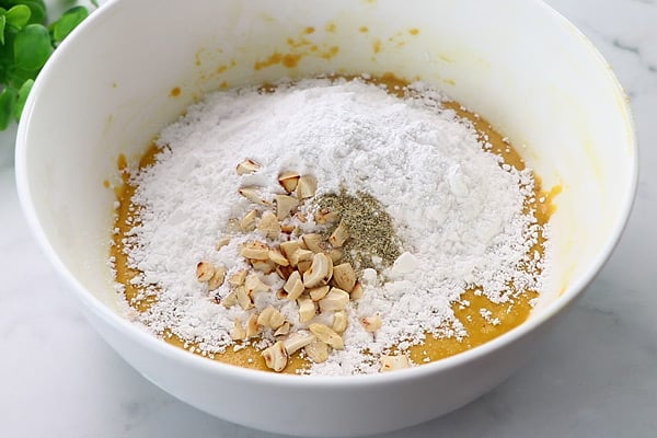 add powdered sugar, cashews and cardamom powder
