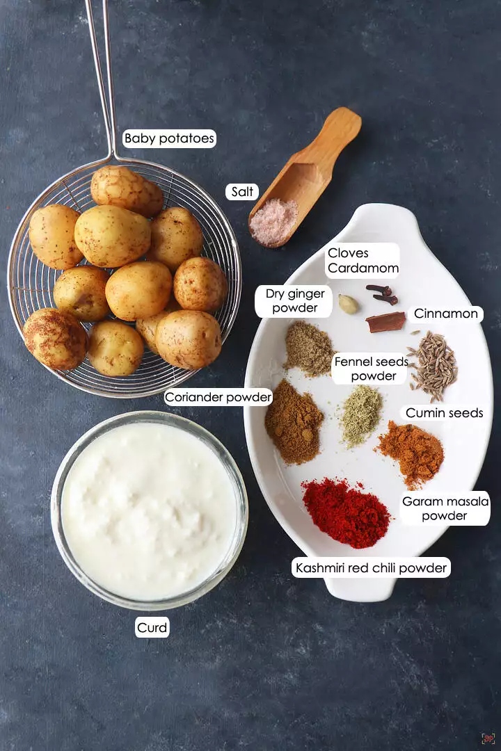 a display of ingredients needed to make kashmiri dum aloo