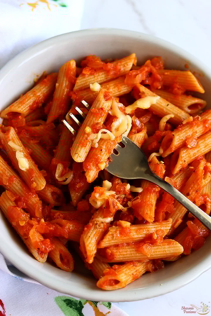 red sauce pasta served with cheese