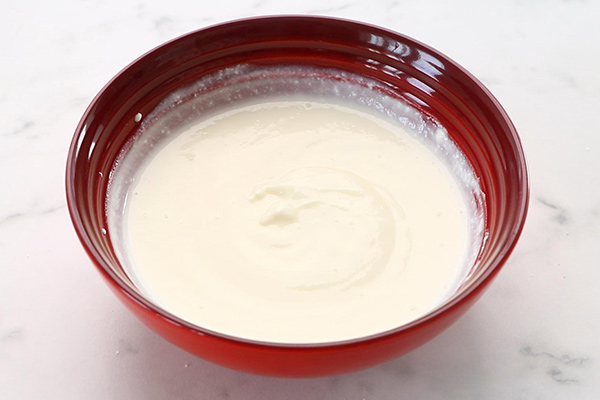 whisk curd in a bowl