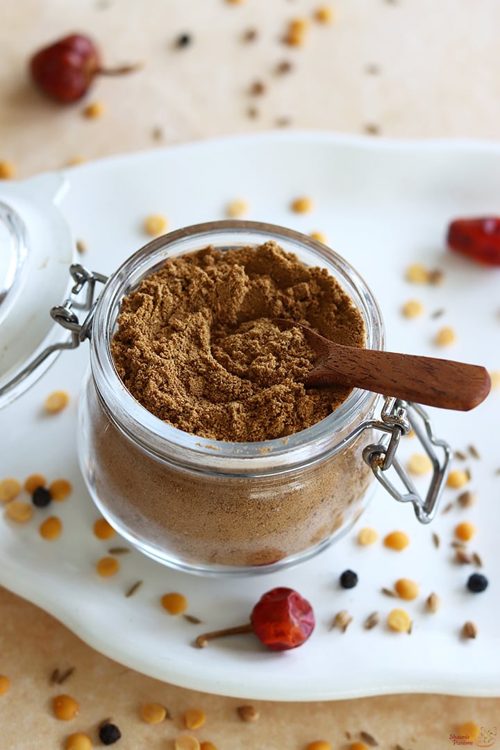 rasam powder stored in a glass jar