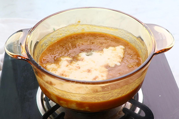 Add cardamom powder, milk