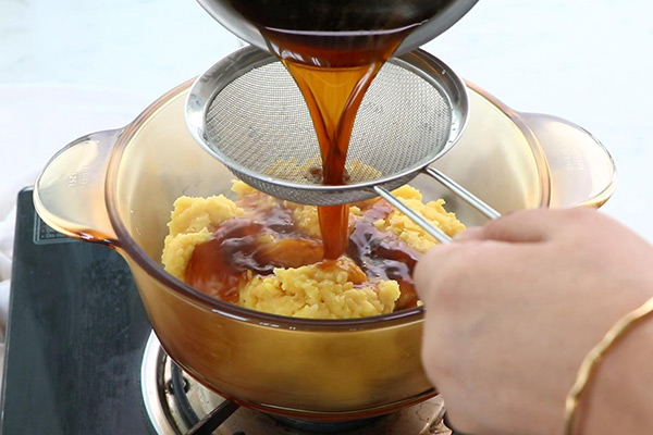 Strain and add jaggery syrup