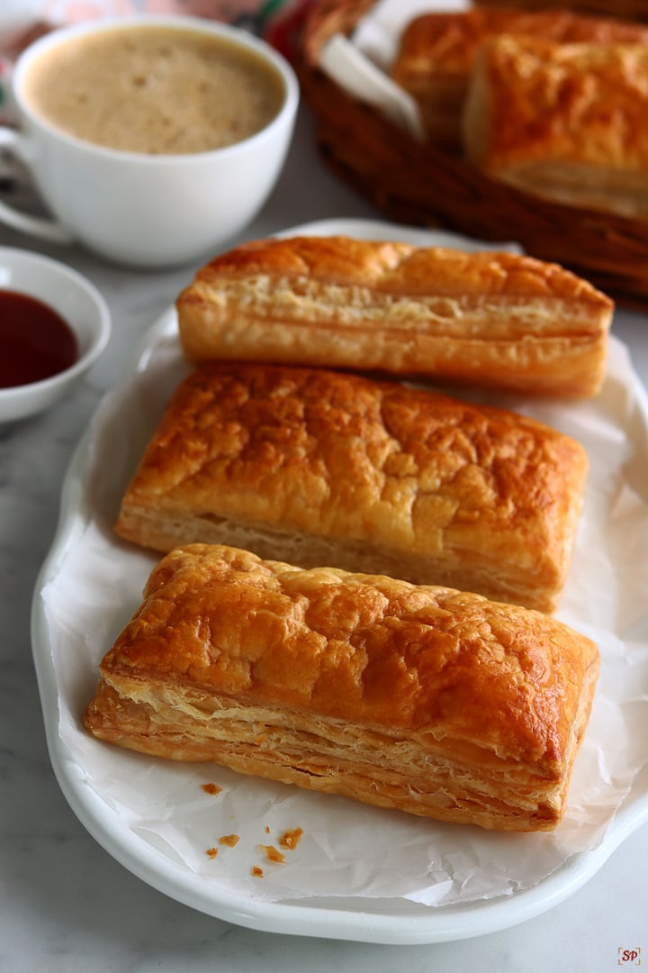 veg puffs served with tomato sauce and coffee