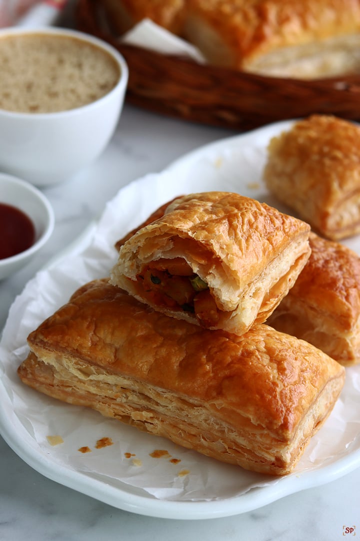 veg puffs served with tomato sauce and coffee