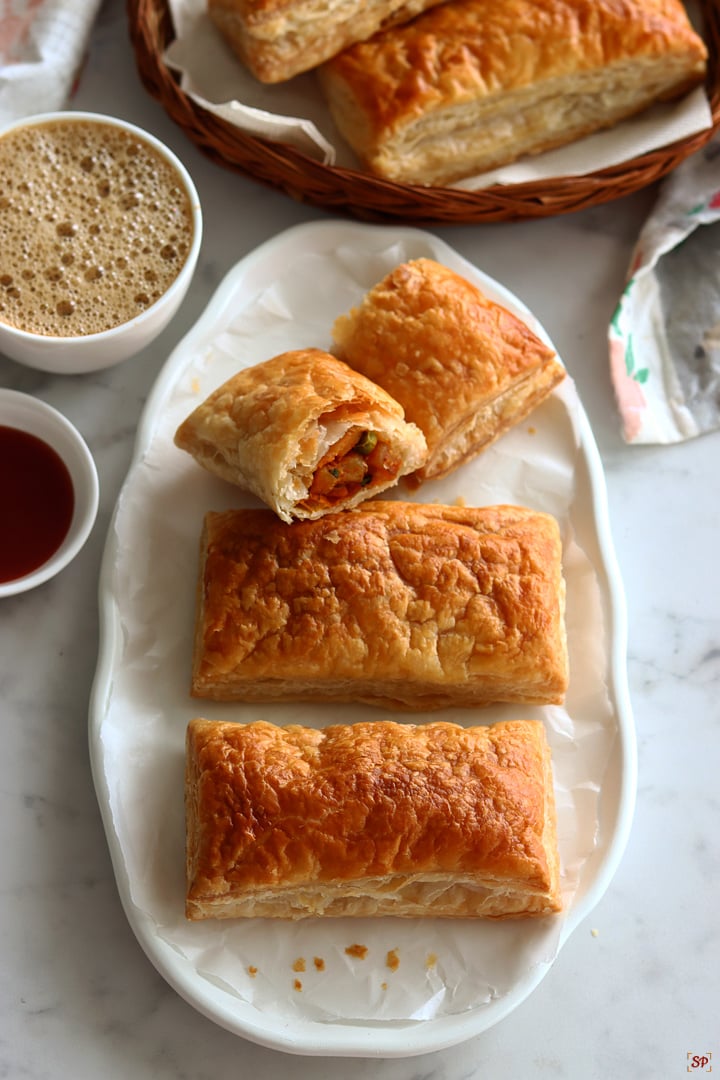 veg puffs served with tomato sauce and coffee