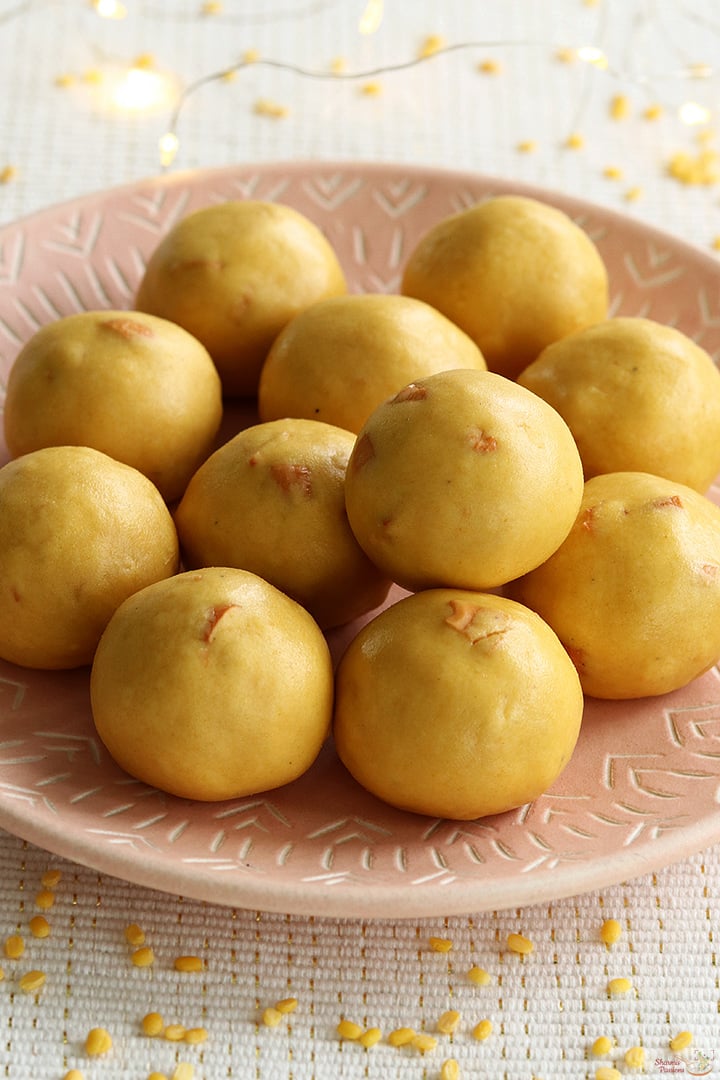 moong dal ladoo served in a pink plate