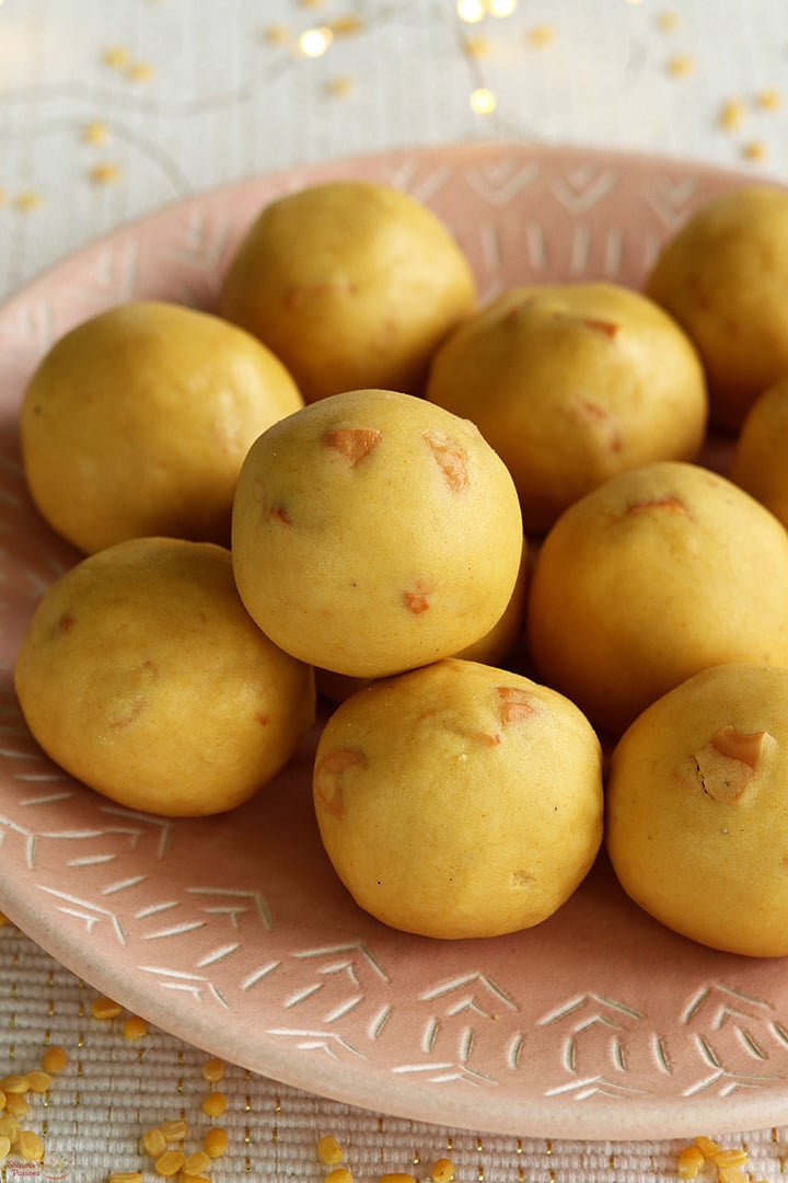 moong dal ladoo served in a pink plate