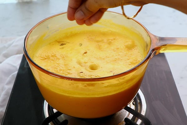 add cardamom powder, nuts