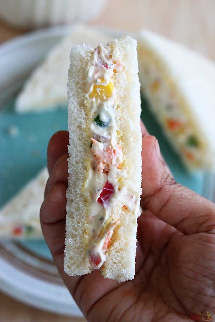 cream cheese sandwich served with a cup of coffee