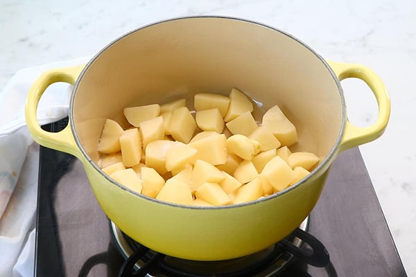 add potatoes, garlic, salt