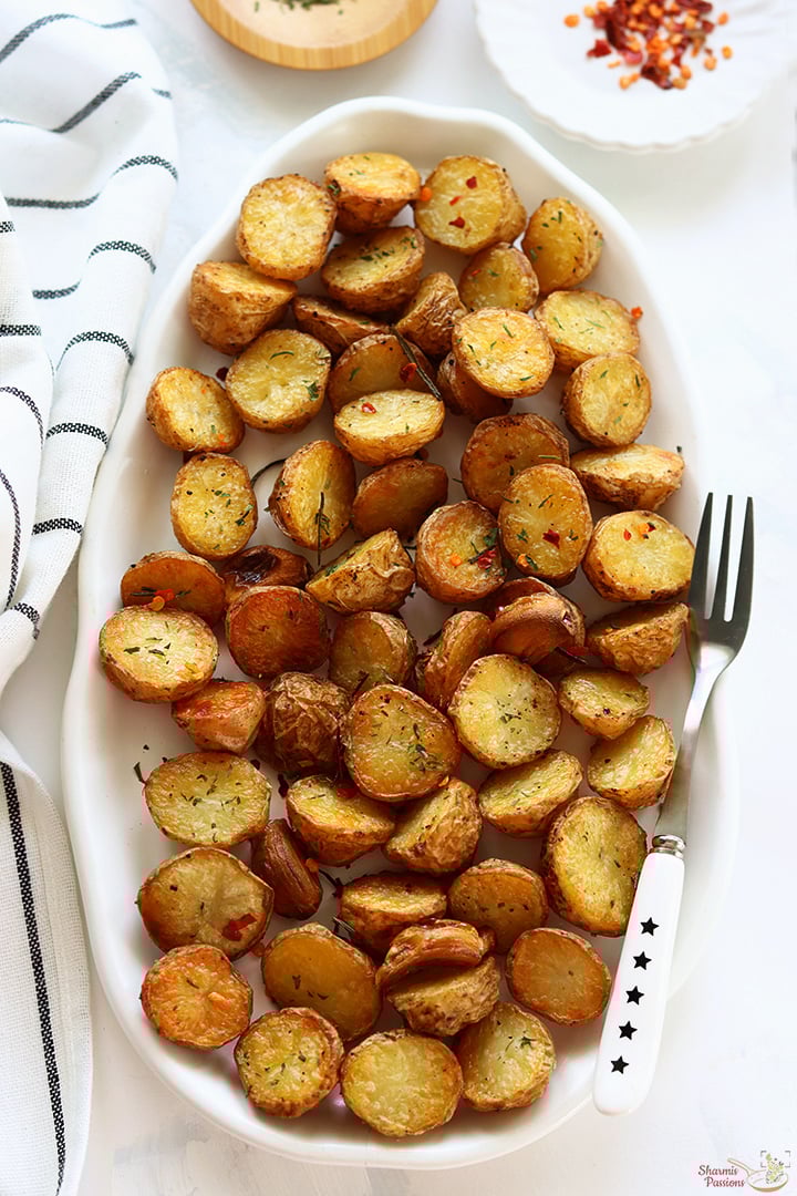 roast potatoes served in a white platter