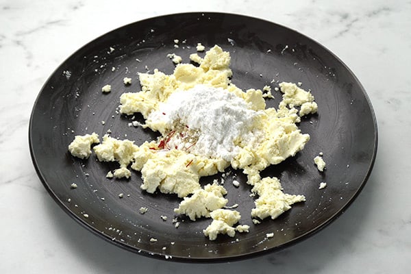 add sugar, cardamom powder and saffron
