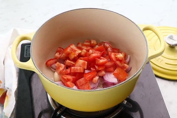 add onion, garlic, tomatoes