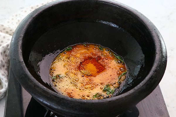 add chilli powder, turmeric. powder and fenugreek seeds powder