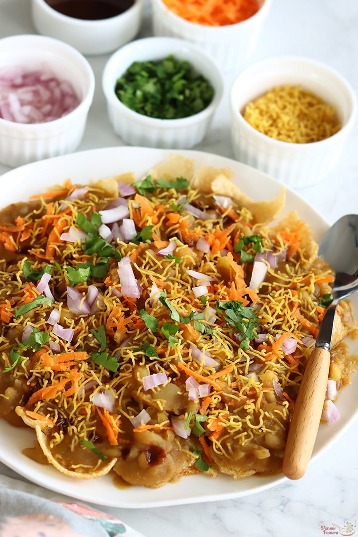 masala puri served in a white plate