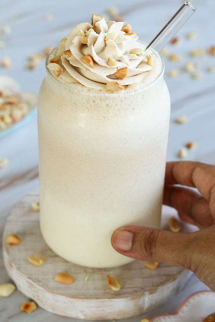 peanut butter milkshake served with whipped cream topping