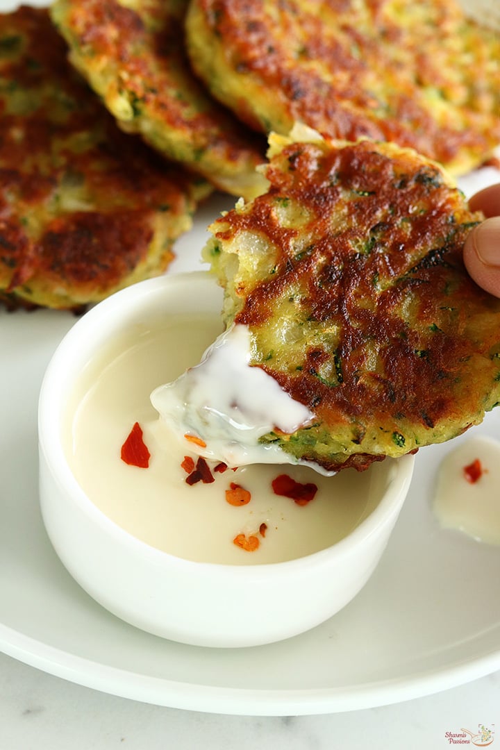 crispy zucchini fritters served with cheese spread