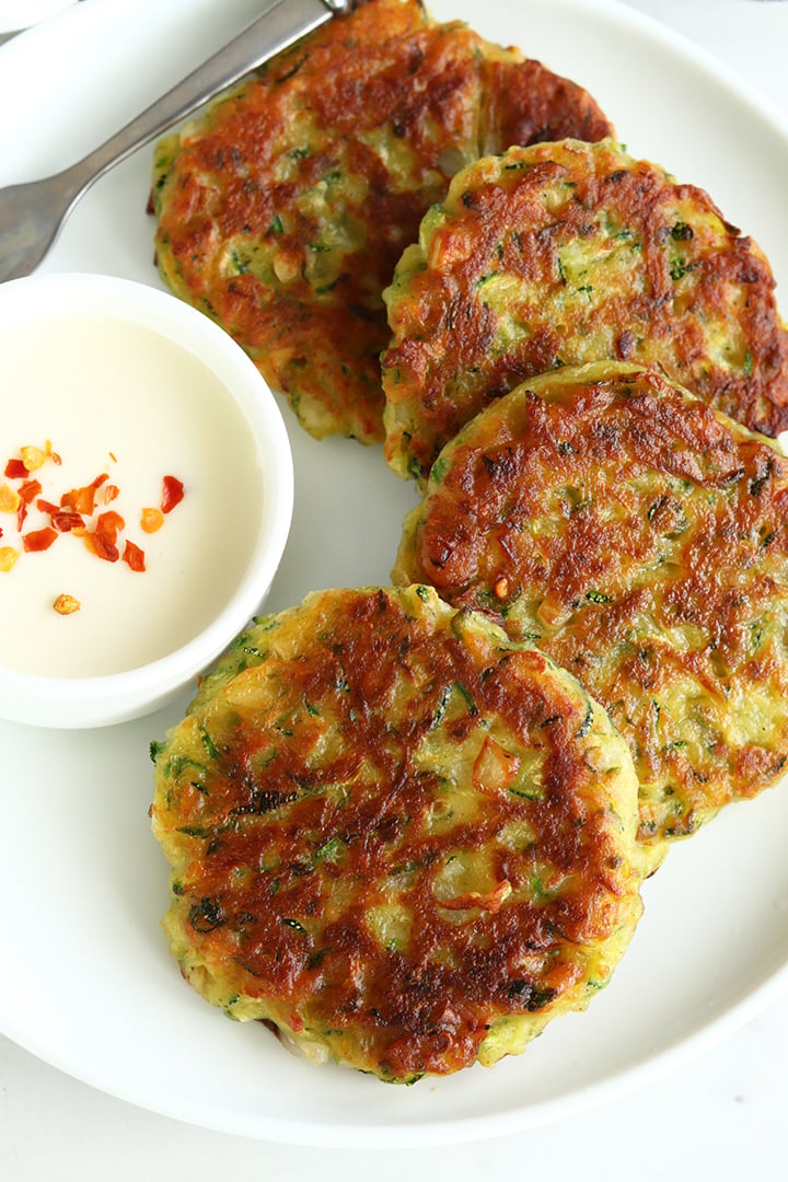 crispy zucchini fritters served with cheese spread